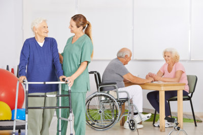 Geriatric nurse with group of senior people